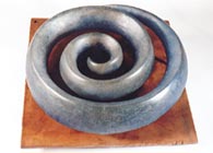 Spiral Levitation - Mold melted glass on metal base. ..click to see full size